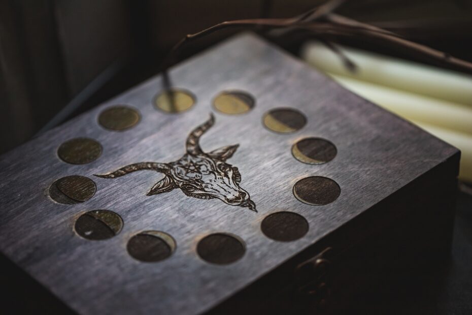 Wooden carved box with the image of Baphomet's head and moon phases